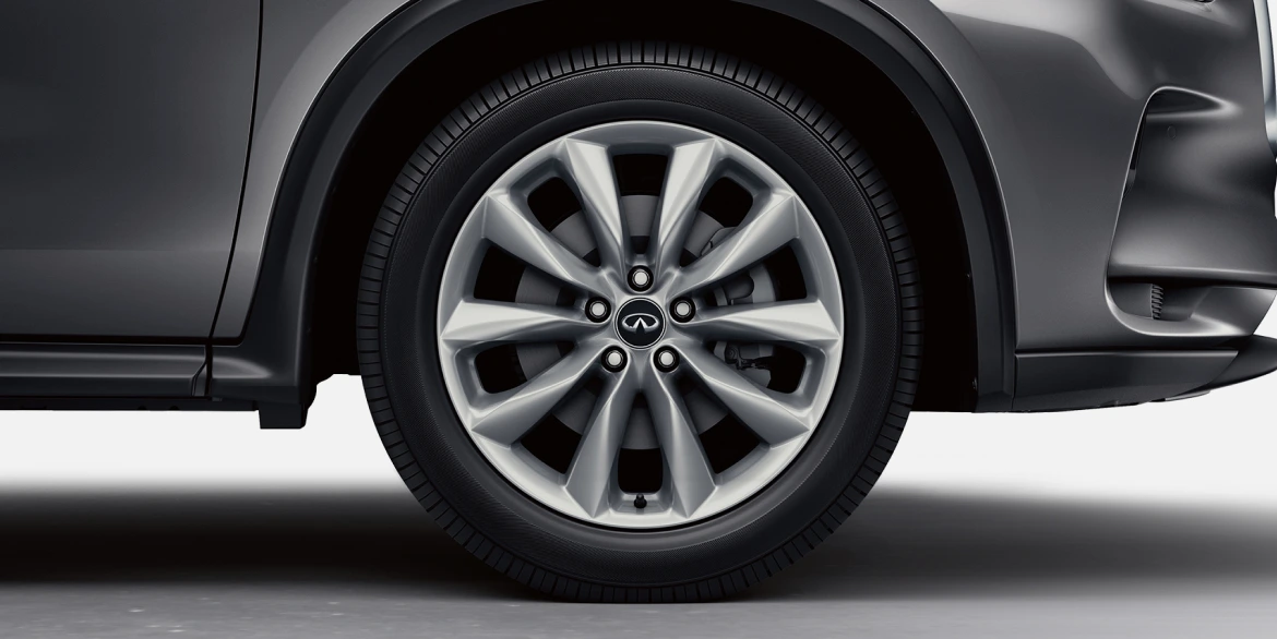 Closeup view of an INFINITI vehicle‘s right front tire.